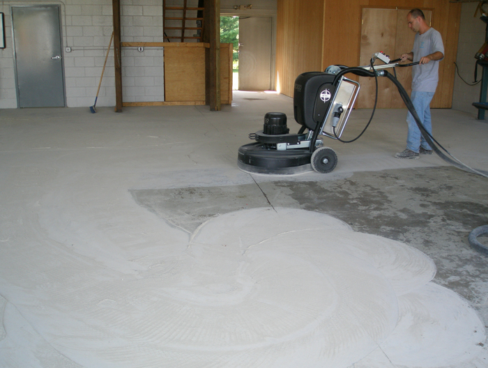 Diamond grinding a concrete slab before epoxy floor coating in Ventura County